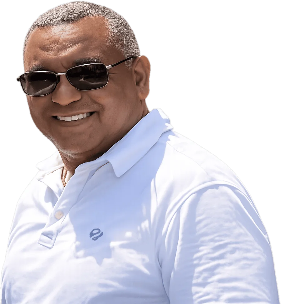Rosario Pierrus, your guide on Mauritius, smiling in a white polo shirt
